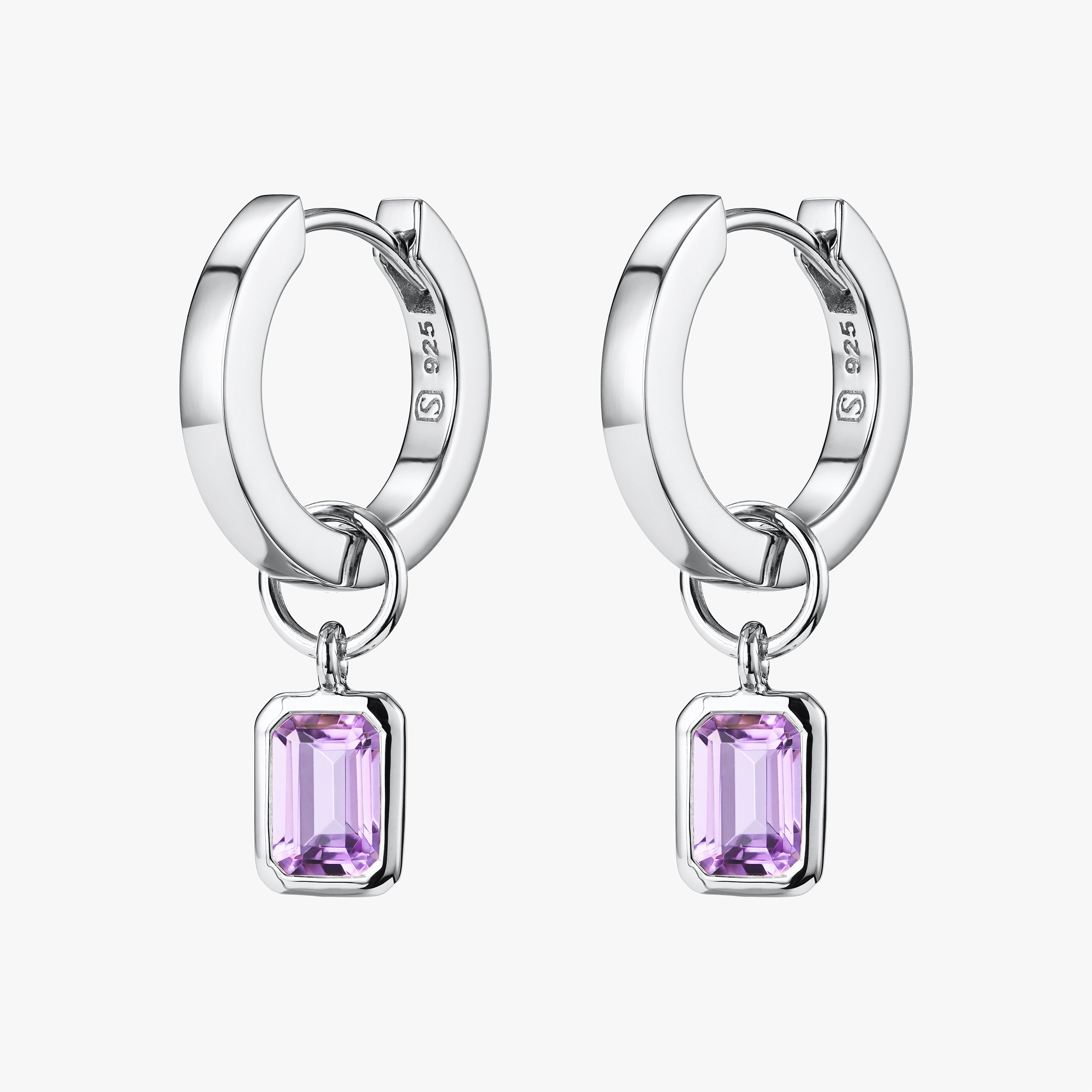 Sterling silver amethyst huggie hoop earrings featuring February's birthstone, amethyst, with interchangeable charms. Crafted from high-quality, hypoallergenic sterling silver for lasting durability and a perfect gift for February birthdays.