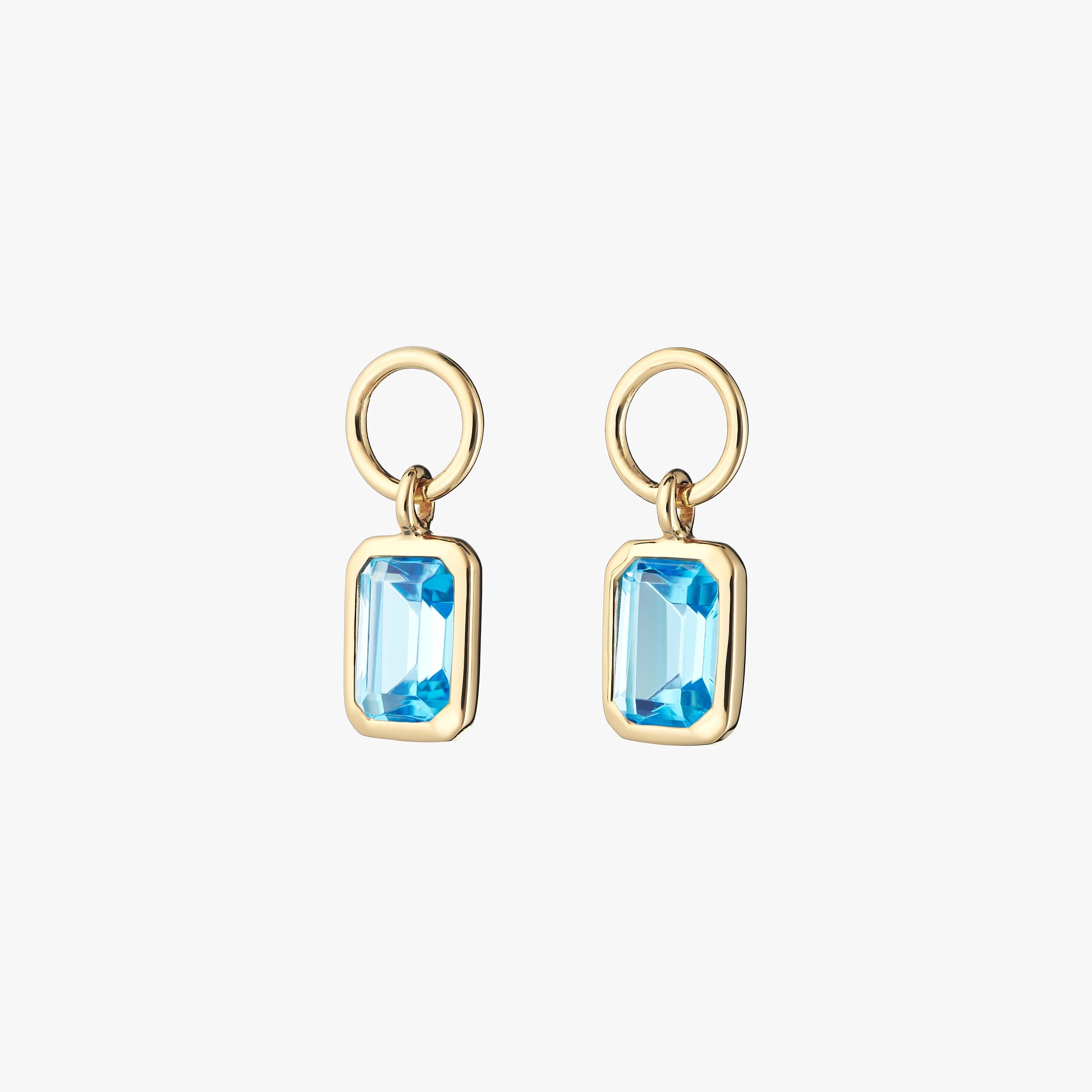 Pair of 18k gold vermeil blue topaz charms perfect for gifting those born in December. to add to a pair of huggie hoop earrings, necklaces or bracelets.