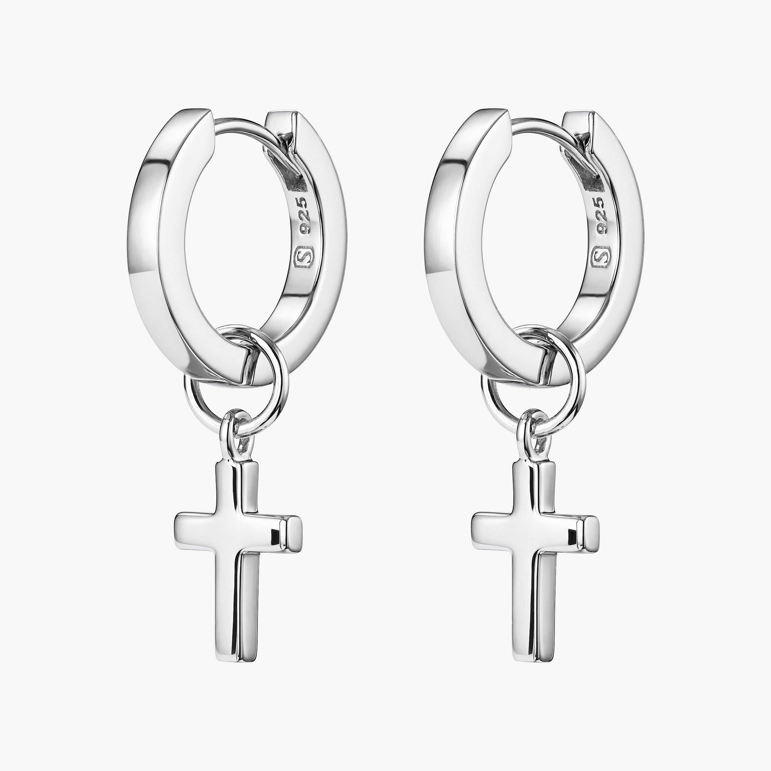 The perfect gift of faith with these sterling silver hypoallergenic huggie hoop earrings with interchangeable cross charms attached.