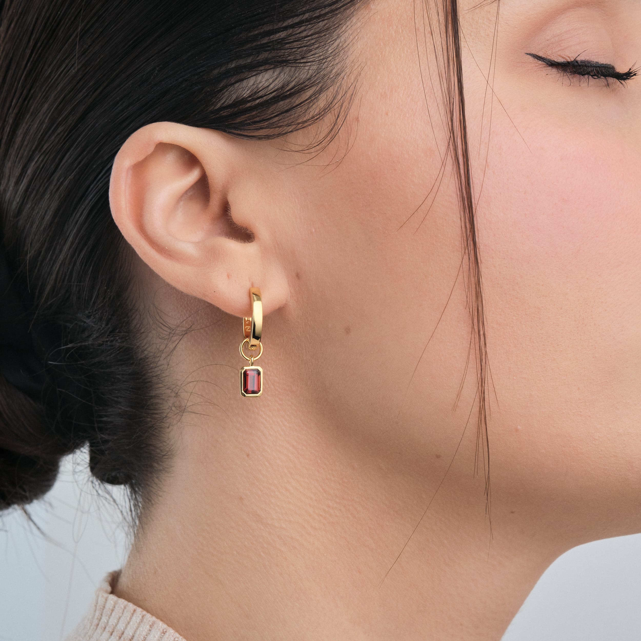 Red Garnet Gemstone Charms in 18k Gold Vermeil being worn side view.