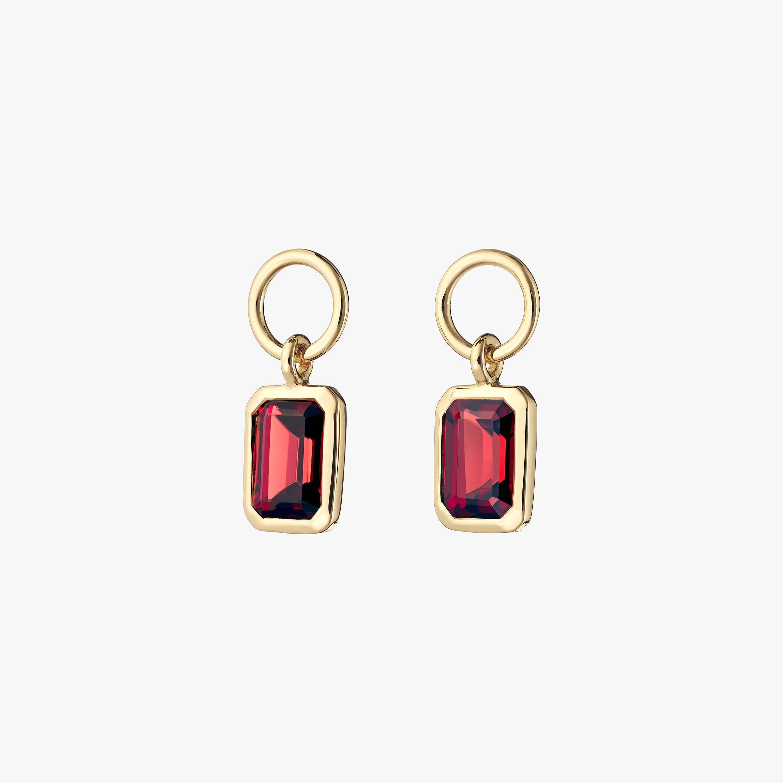 Vibrant fiery red garnet gemstone charms in a pair coated with opulent 18k gold vermeil. Perfect to add to any pair of huggie hoop earrings, necklaces or bracelets.