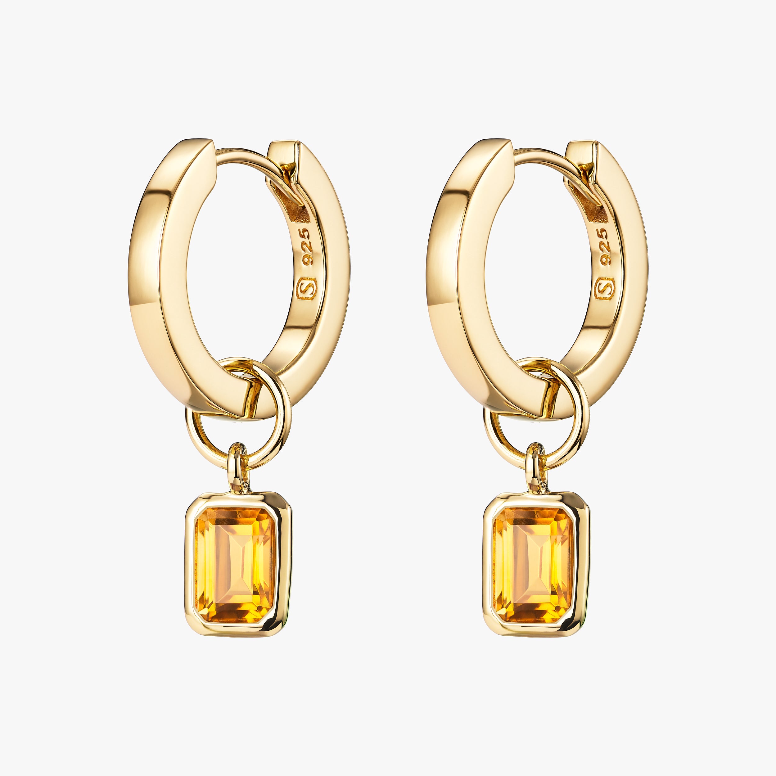 A timeless piece of 18k Gold Vermeil huggie hoop earrings designed for daily wear and durability with the perfect birthday gift for November with detachable Golden Citrine gemstone charms attached.