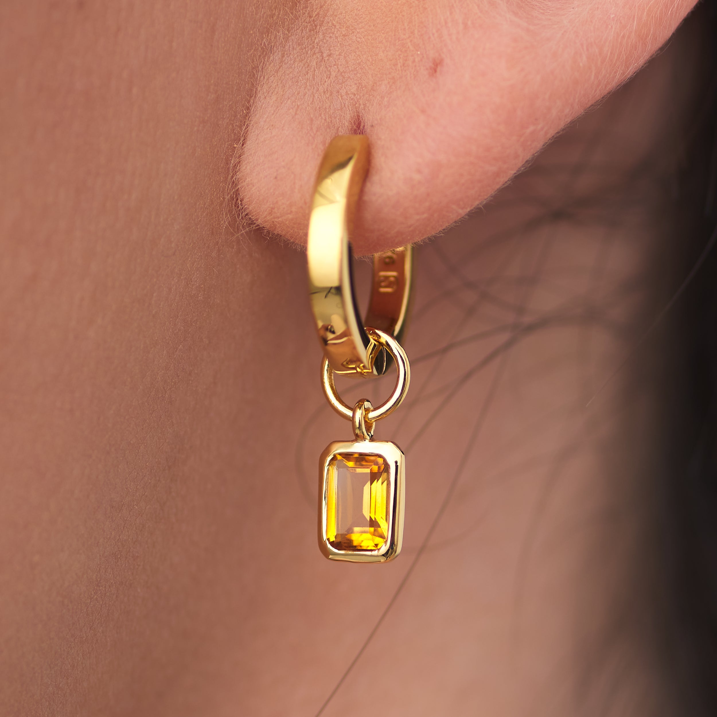 Elegant and ready for everyday wear 18k gold vermeil huggie hoop earrings with personalised golden citrine gemstone charms the perfect gift.