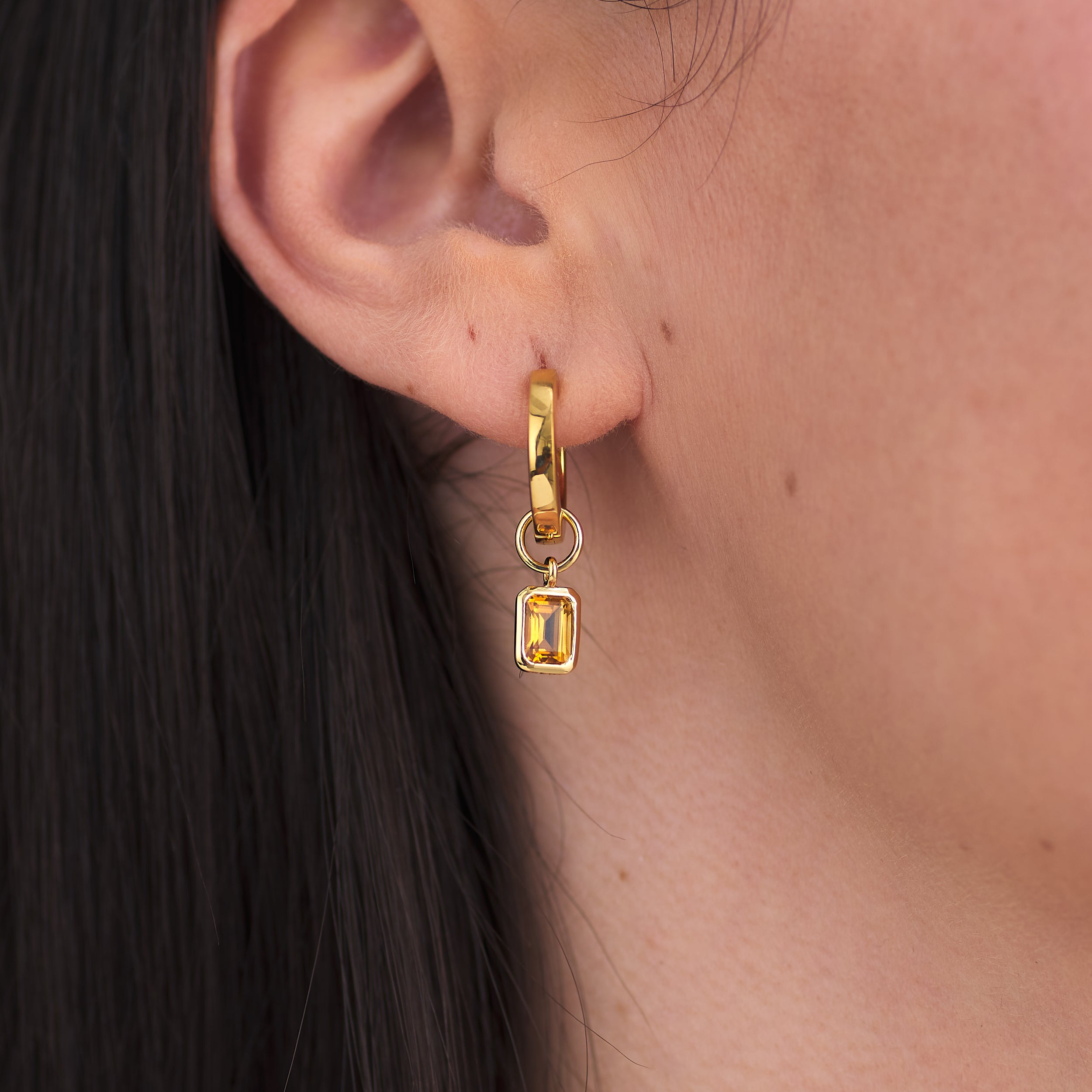 18k Gold Vermeil huggie hoop earrings with vibrant golden citrine gemstone charms that are ethically crafted, offering beauty and quality without the high price tag.