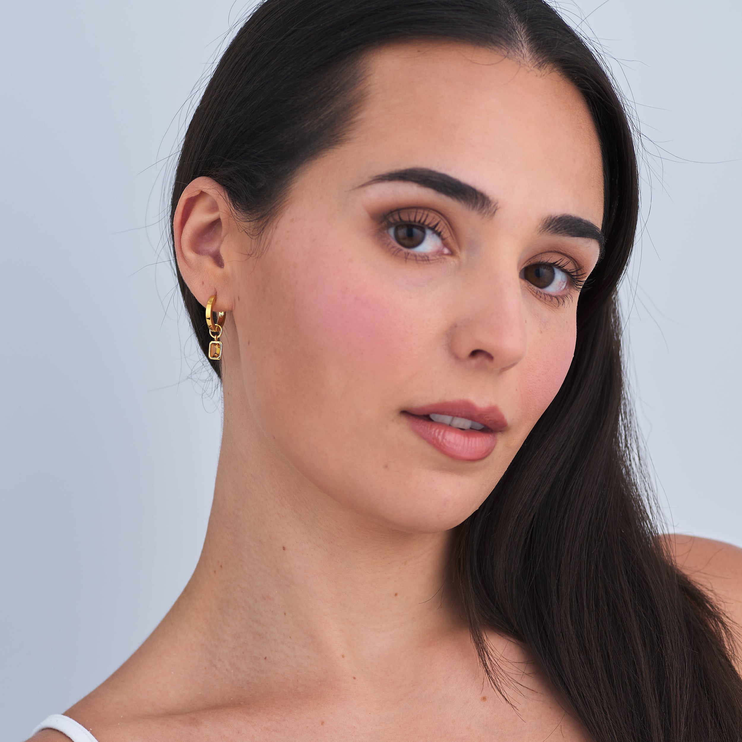 Beautiful and classic gold vermeil in 18k huggie hoop earrings with adjustable golden citrine charms attached.