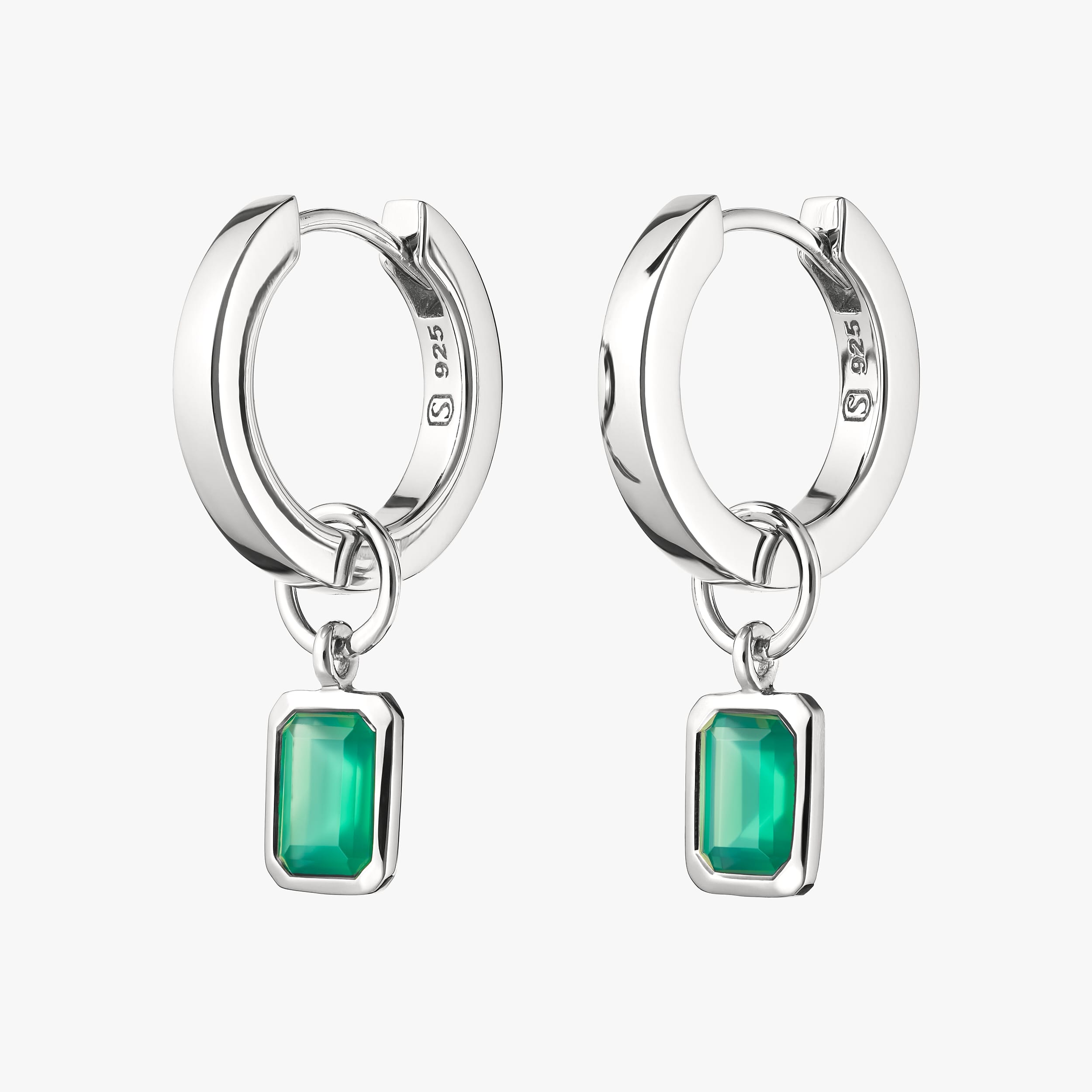 Sterling silver huggie hoop earrings with interchangeable green onyx gemstone charms crafted from hypoallergenic sterling silver, these earrings provide a customisable, affordable option with the rich green of onyx, perfect for adding a pop of colour to any look. The perfect birthstone for May.
