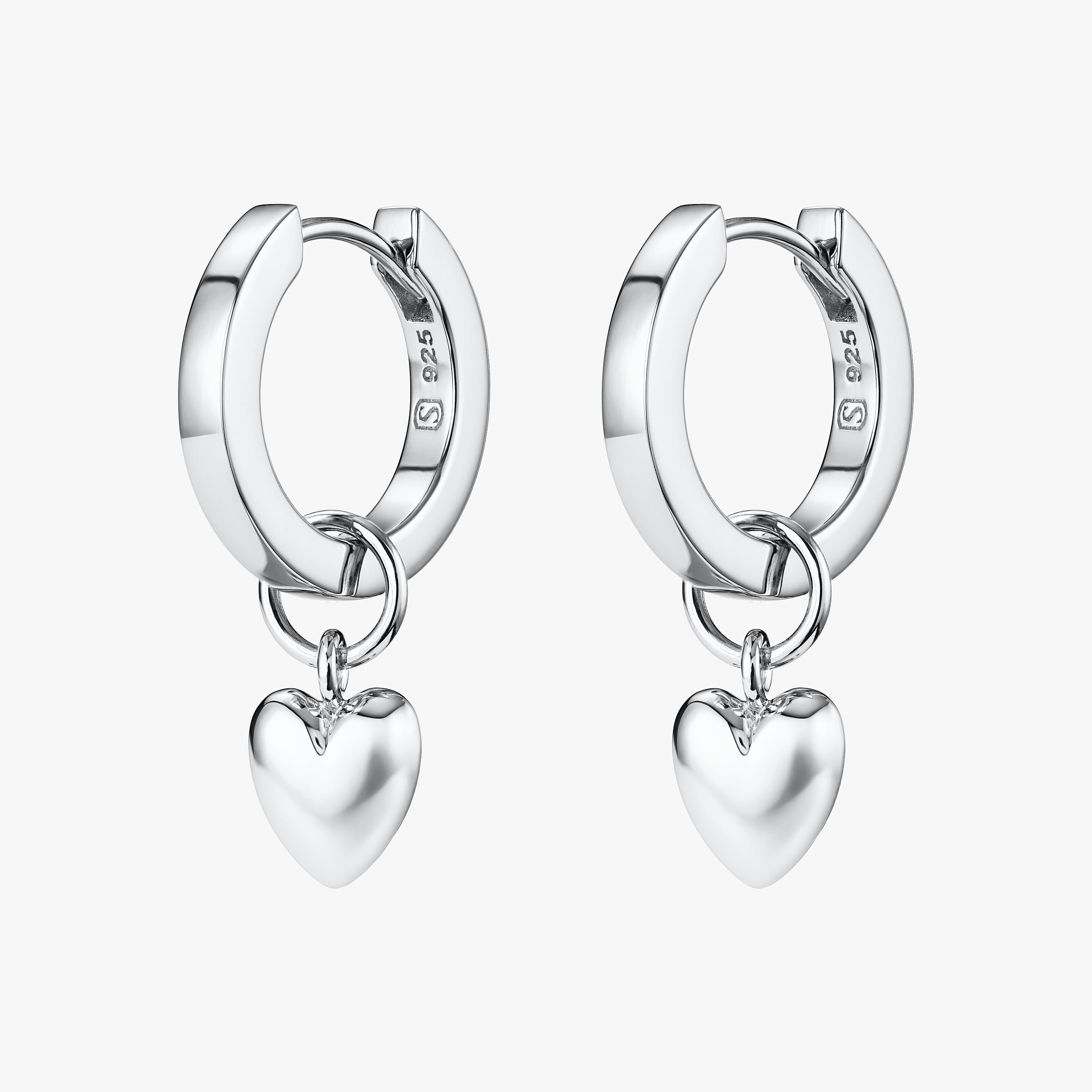 Sterling silver puffy heart charm huggie hoop earrings, crafted with hypoallergenic sterling silver for durability and timeless beauty, the perfect gift for a loved one.