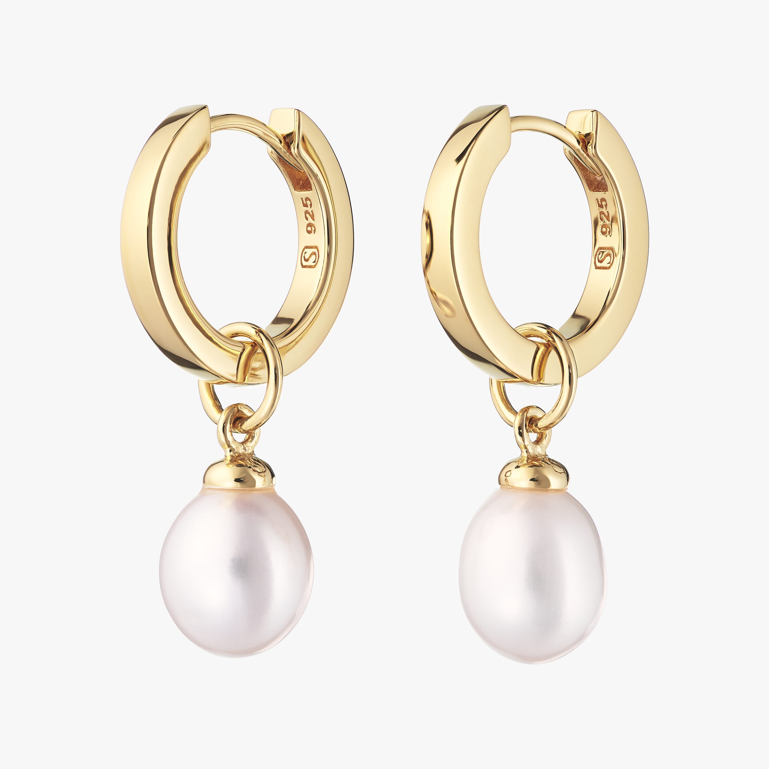 18K gold vermeil huggie hoop earrings with interchangeable pearl charms versatile and customisable, perfect for adding a personal touch to wedding jewellery or as a thoughtful gift. Crafted from durable 18K gold vermeil, these earrings offer luxurious style at an affordable price.