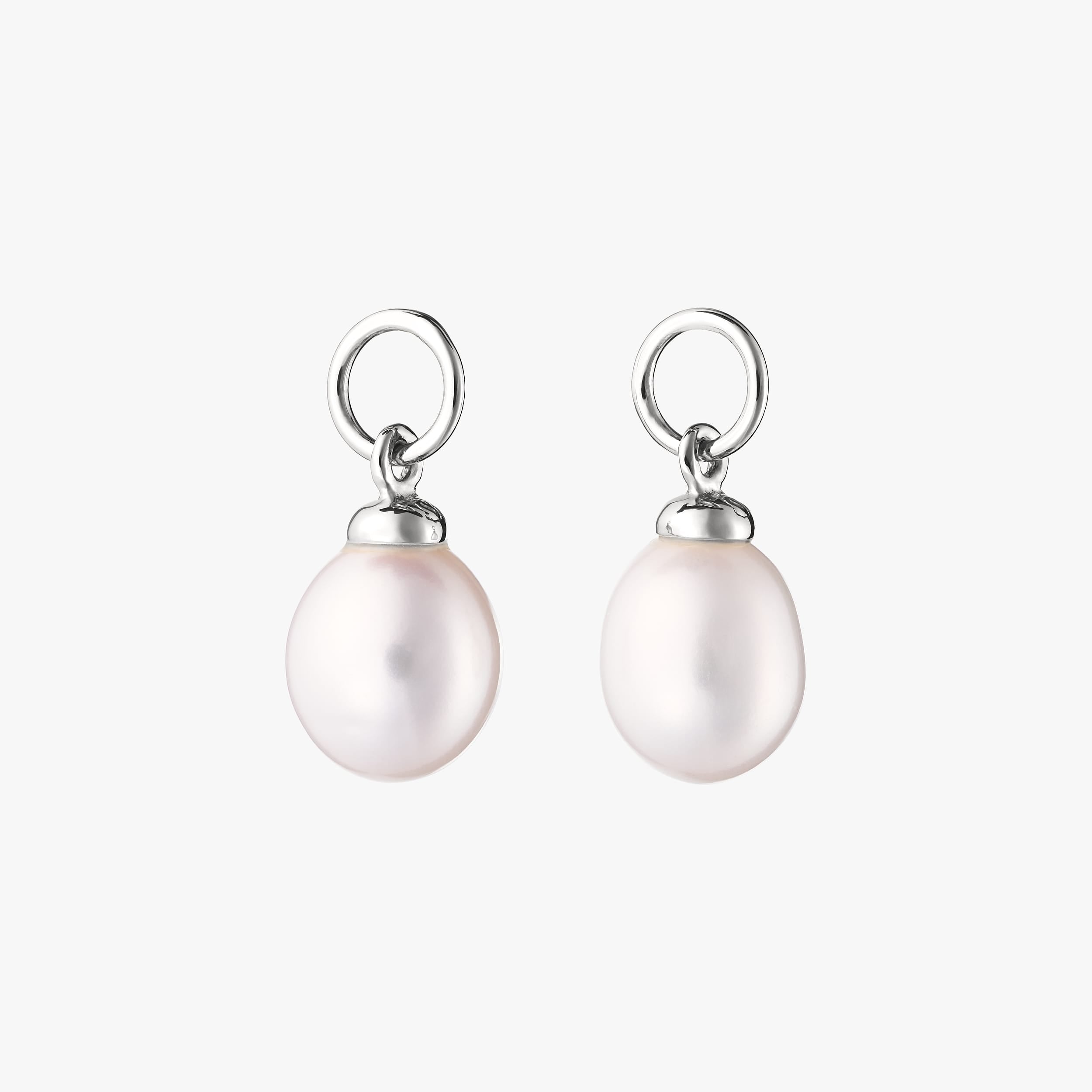 Elegant pair of sterling silver pearl charms. A timeless wedding accessory, perfect for adding sophistication to bridal jewellery.