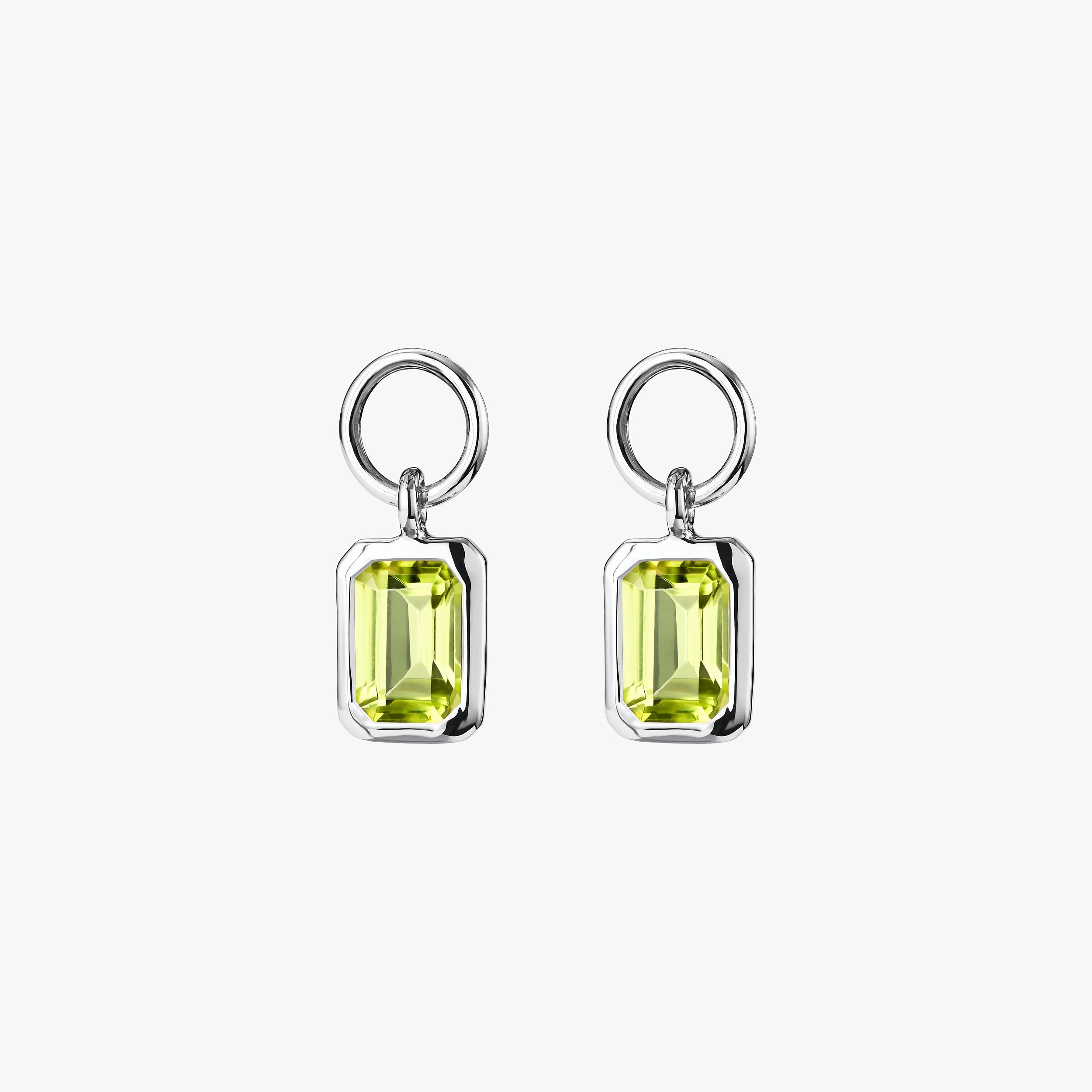 Sterling silver peridot charms, vibrant gemstone jewellery, featuring August's birthstone, perfect for thoughtful birthday gifts and adding a touch of elegance to earrings or necklaces.