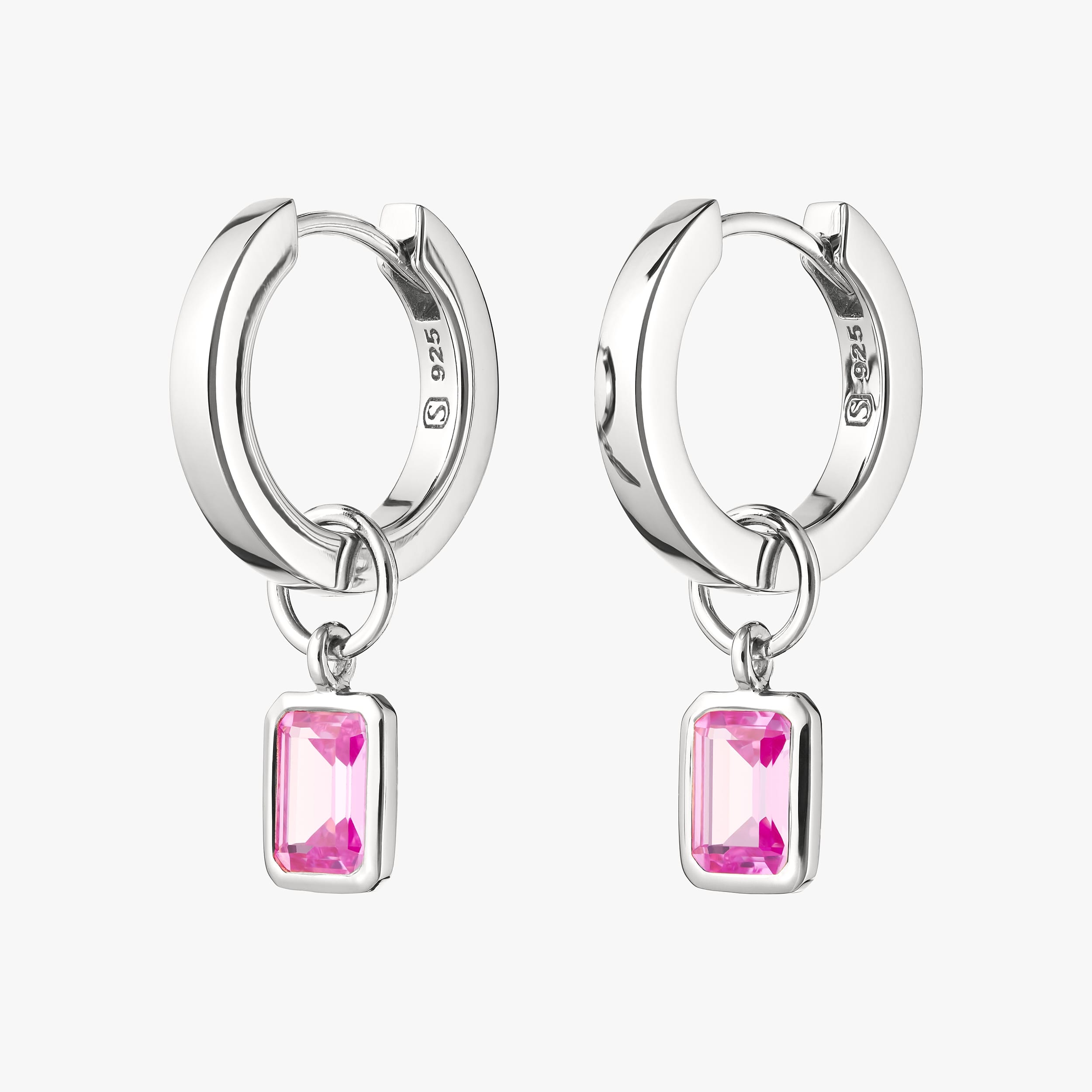 Sterling silver huggie hoop earrings with interchangeable pink ruby gemstone charms crafted from durable, hypoallergenic sterling silver, perfect for adding a pop of colour to any look. Ideal for customising jewellery, these earrings offer timeless elegance at an affordable price.
