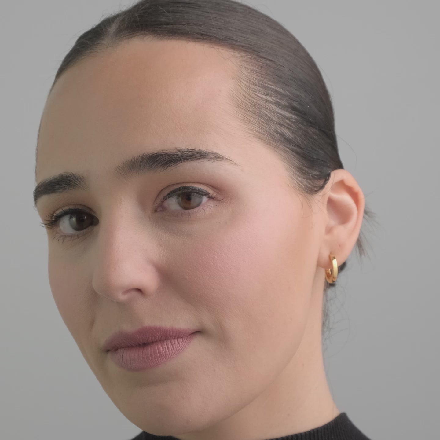Huggie Hoops in 18k Gold Vermeil - Beautiful Gold Vermeil Earrings video of a woman wearing them.