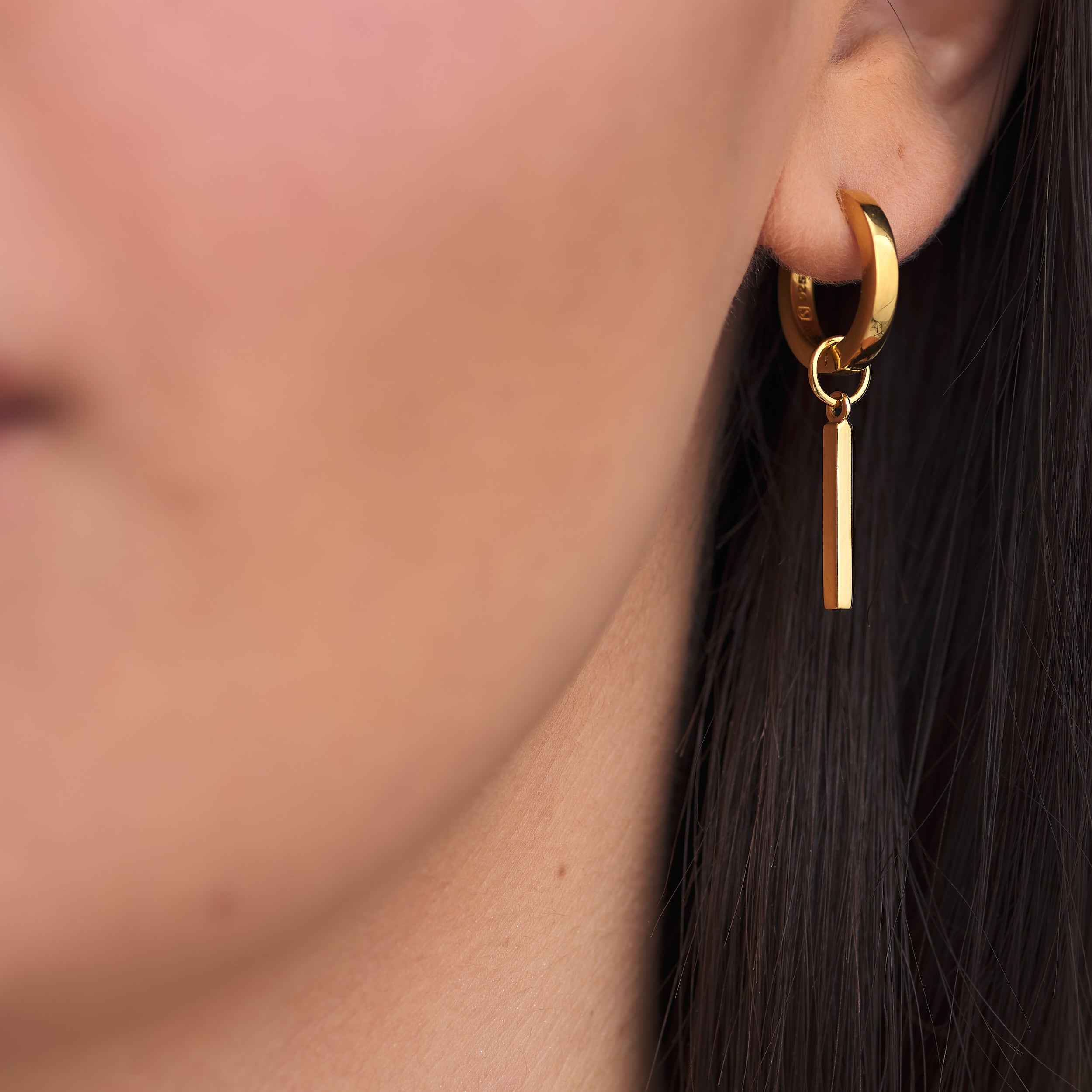 Affordable 18k Gold Vermeil Huggie Hoop earring with customisable rod charm attached.