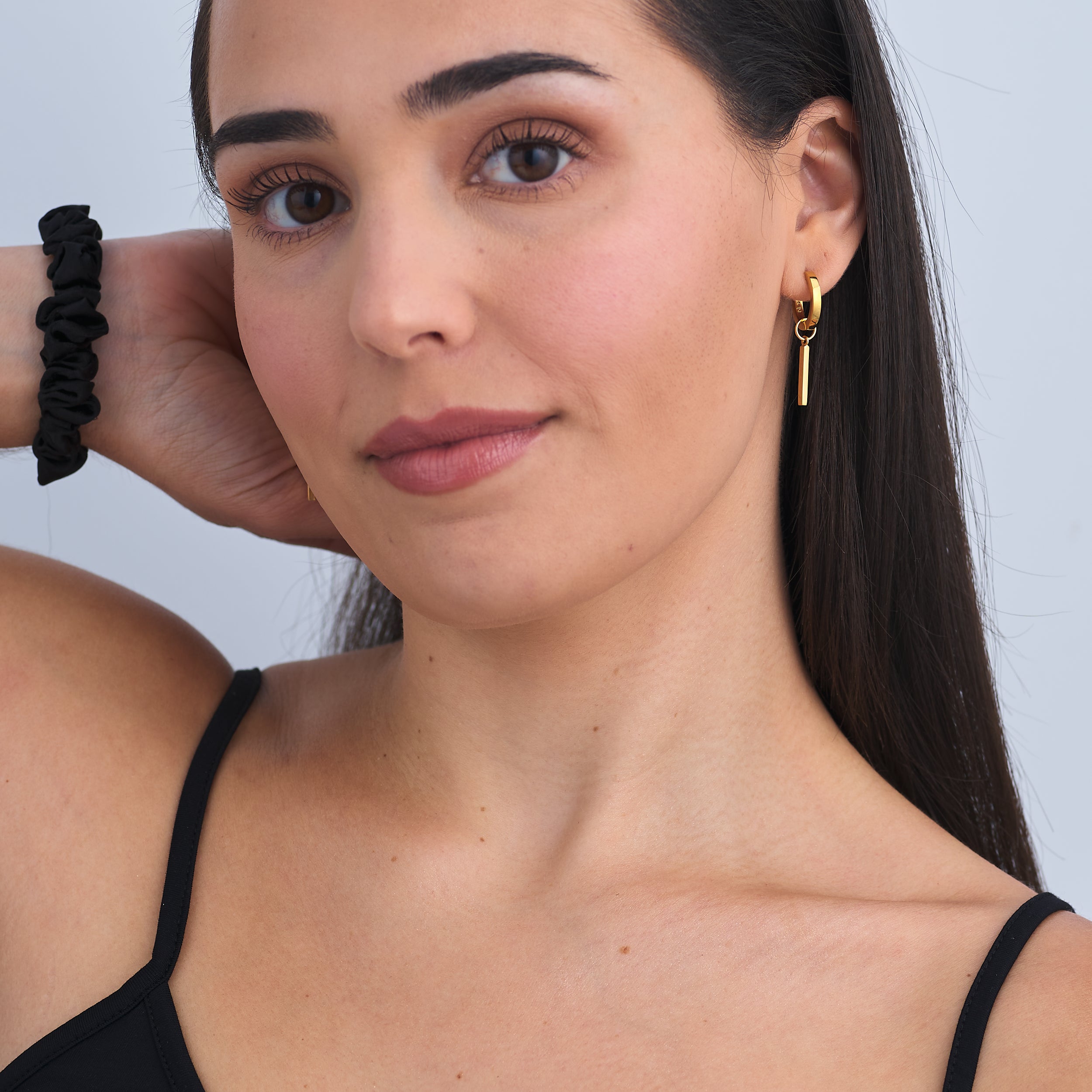 A timeless investment that never goes out of style, these 18k Gold Vermeil Huggie Hoop earring with customisable rod charms attached.