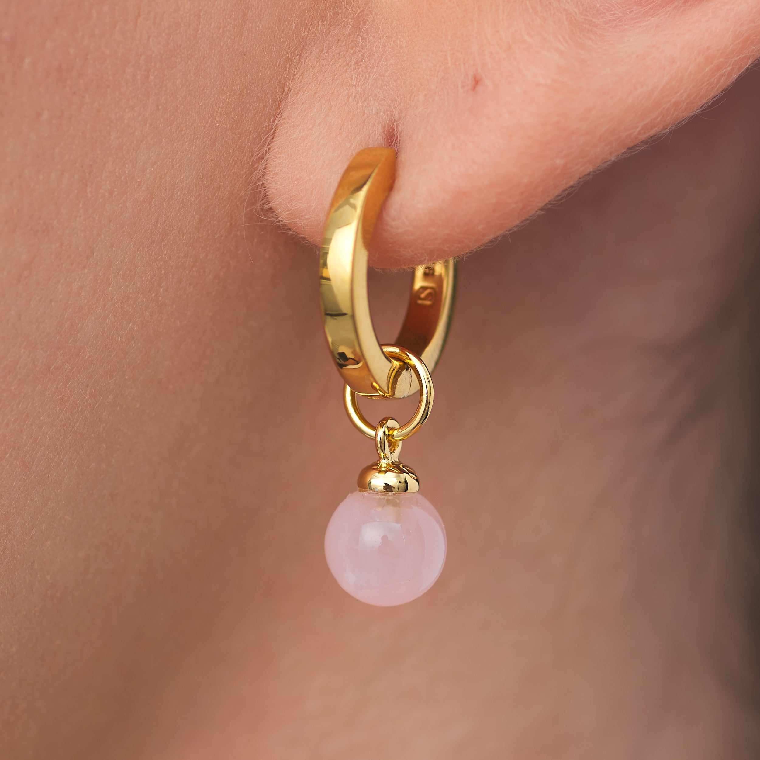 Stunning 18k Gold Vermeil Huggie hoop earrings with customisable Rose Quartz gemstone charm attached.