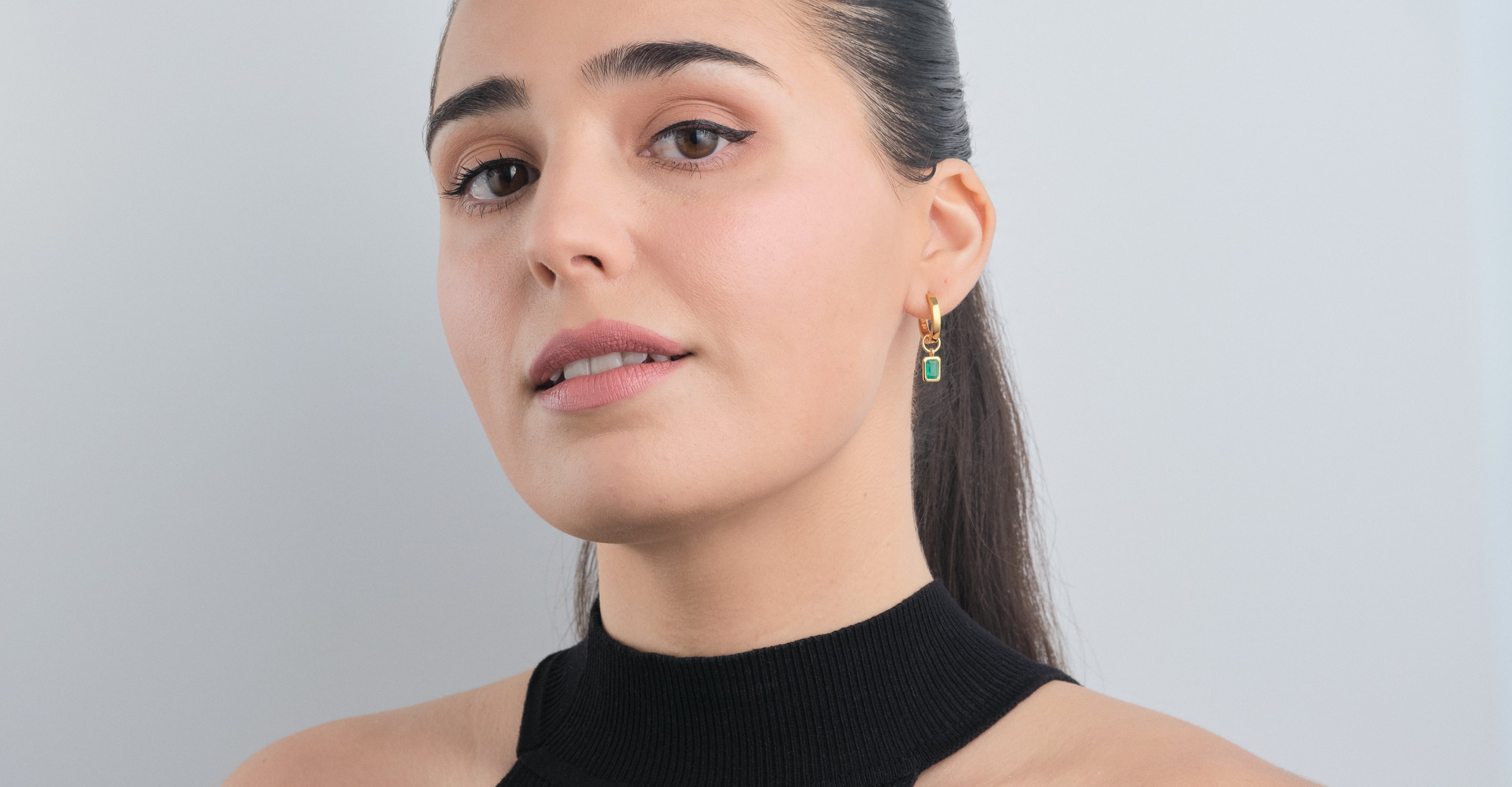 Green Onyx Huggie Set in Vermeil - Beautiful Green Onyx Earrings being worn by a woman front view