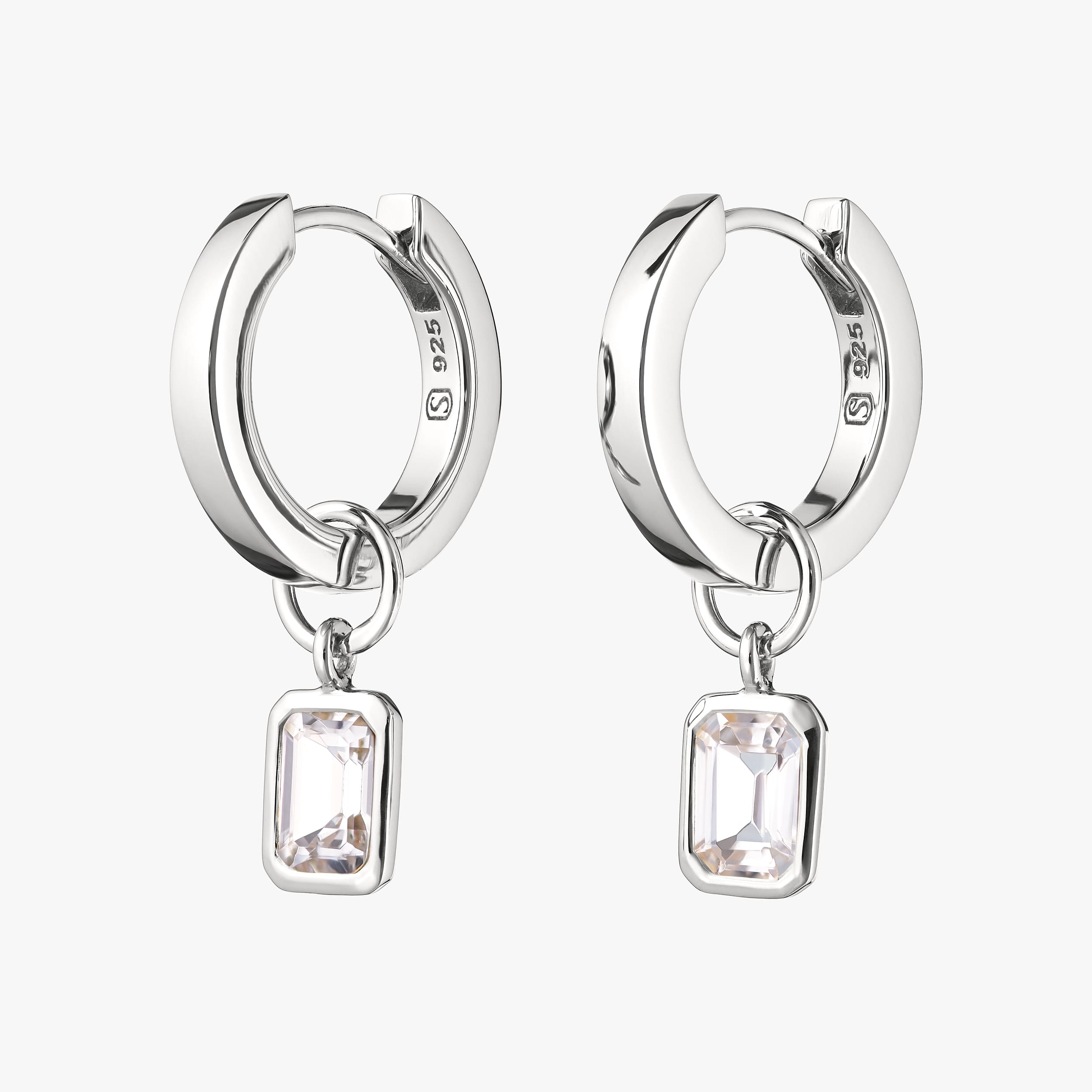 Sterling silver huggie hoop earrings with interchangeable white topaz gemstone charms featuring sparkling white topaz set in hypoallergenic sterling silver, these earrings offer a versatile, affordable luxury piece that can be customised for any occasion.