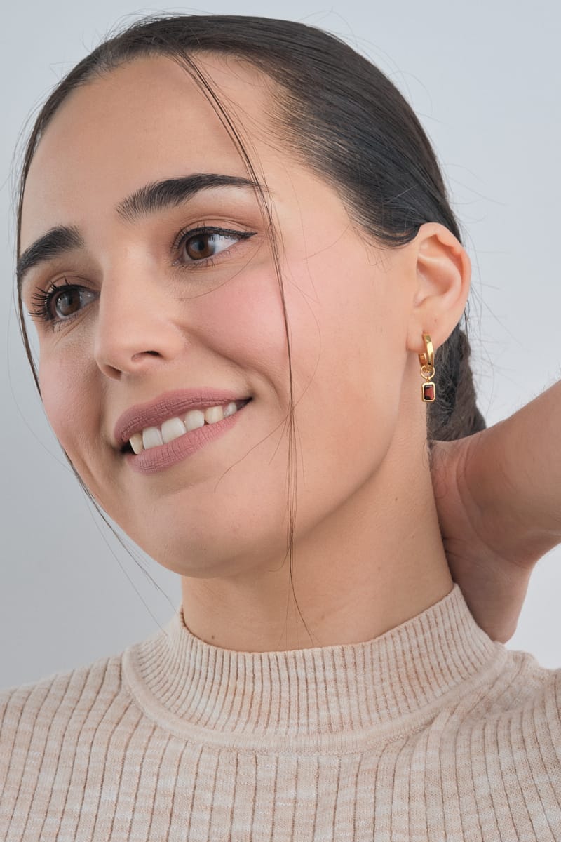 Red Garnet Set in Gold Vermeil - Beautiful Red Garnet Earrings being worn by a woman front view